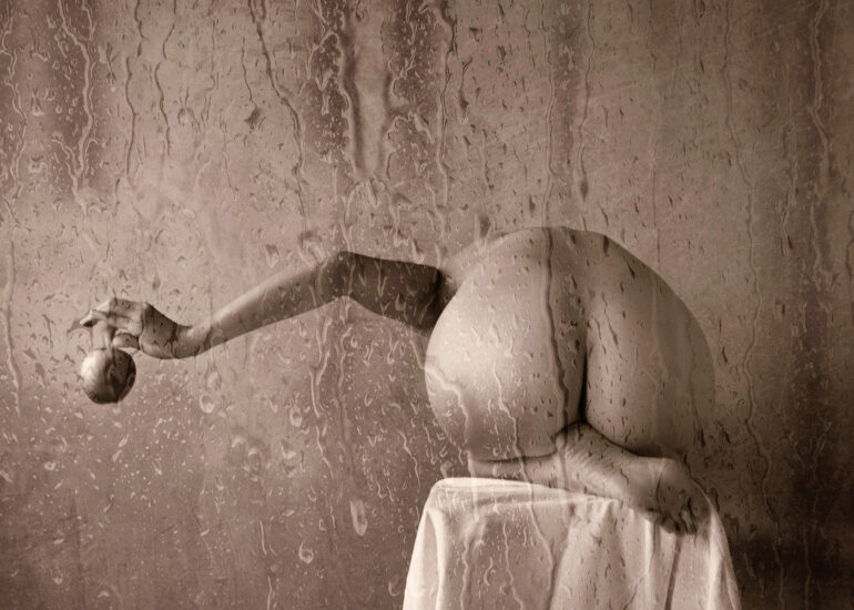 Contemporary fine art nude photograph with water, glass textures, and a calm, poetic atmosphere