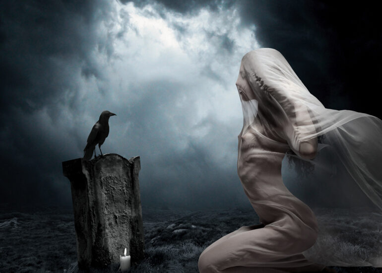 Surreal fine art artwork of a veiled nude woman kneeling before a grave with a raven perched upon it and candle in a mist-filled night landscape.