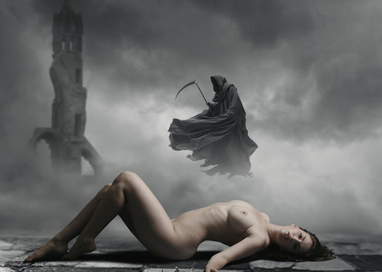 Gothic surreal photography featuring a nude figure, broken crown and hooded reaper in mist.